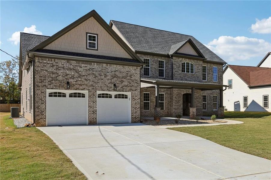 Front exterior of a new home in , Lilburn, GA, highlighting curb appeal (Image 27).