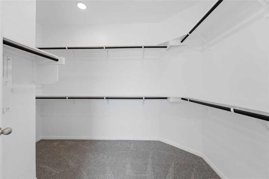 Walk into this generous closet, offering ample shelving and hanging space for all your storage needs. Walk into this generous closet, offering ample shelving and hanging space for all your storage needs.
