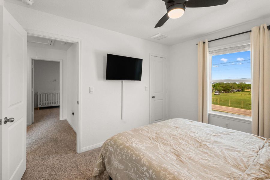 One of two guest bedrooms upstairs, hallway leading to second guest bedroom to the left One of two guest bedrooms upstairs, hallway leading to second guest bedroom to the left
