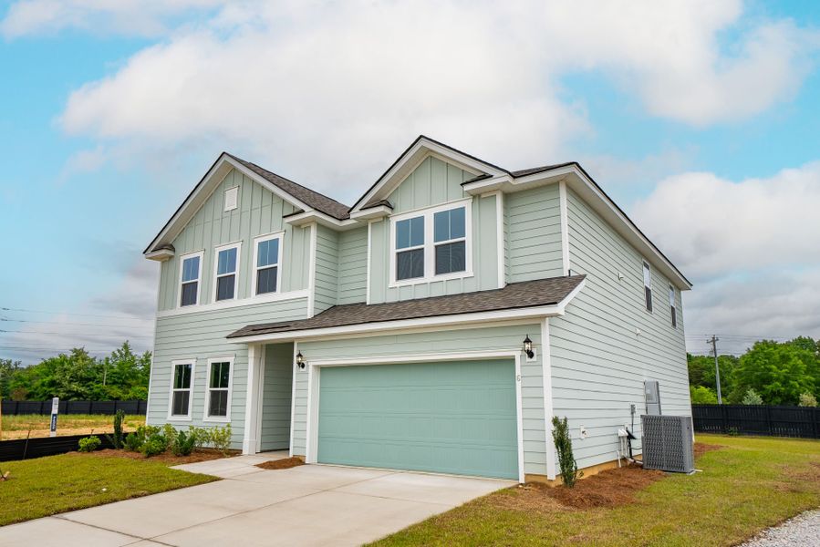 Front exterior of a new home in Monroe Preserve, Chapin, SC, highlighting curb appeal (Image 22).