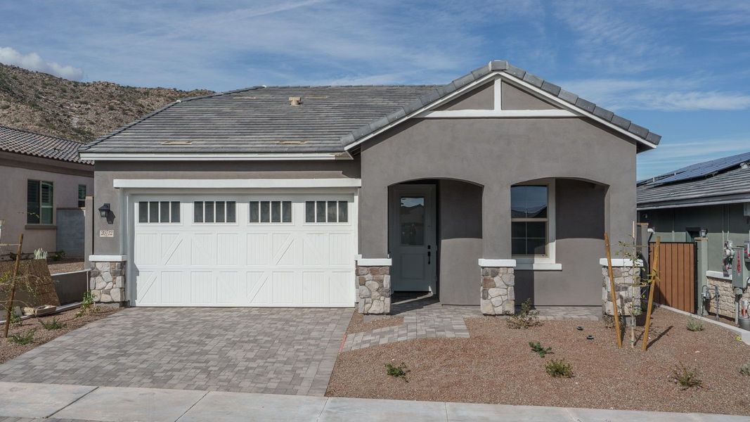 Representative exterior photo of a completed home built from the Pinehurst by William Ryan Homes in Fairways in Victory at Verrado, Buckeye, AZ (Image 22).