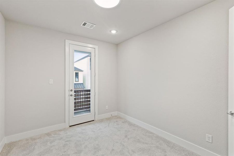 View of carpeted spare room