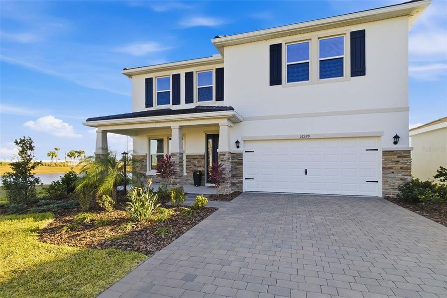 Front exterior of a new home in Star Farms at Lakewood Ranch, Lakewood Ranch, FL, highlighting curb appeal (Image 27).