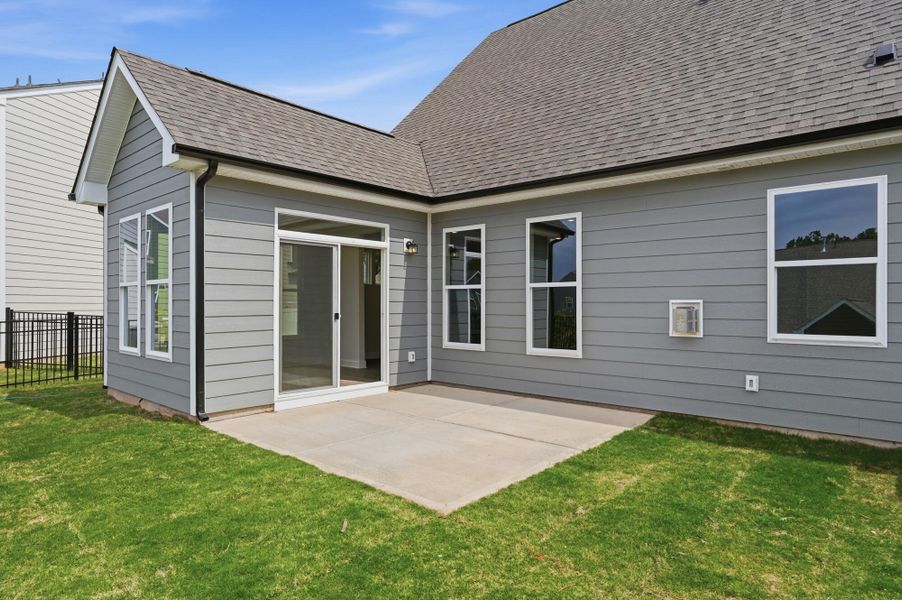 Exterior details and patio area of a home in Villas at Prestwick, Mooresville (Image 3).