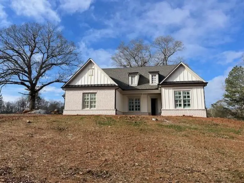 Front exterior of a new home in , Cumming, GA, highlighting curb appeal (Image 1).