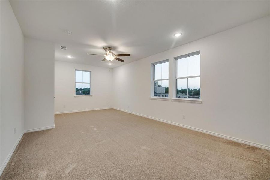 Unfurnished room with light colored carpet, recessed lighting, and a ceiling fan