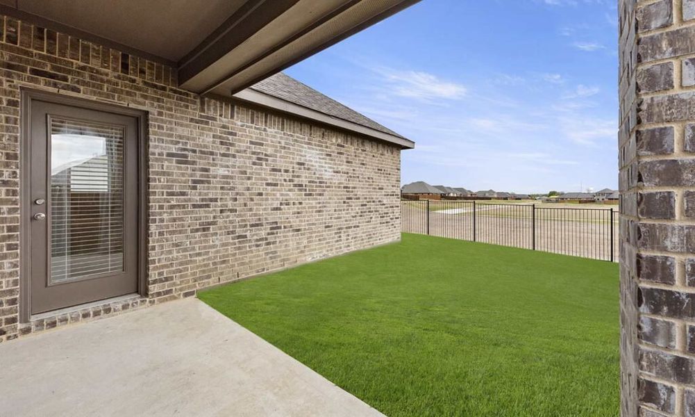 Representative exterior photo of a completed home built from the Brighton by Impression Homes in Arcadia Trails, Balch Springs, TX (Image 27).
