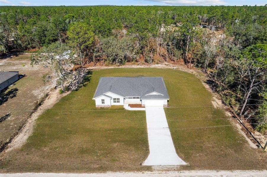 Front exterior of a new home in , Dunnellon, FL, highlighting curb appeal (Image 2). Front exterior of a new home in , Dunnellon, FL, highlighting curb appeal (Image 2).
