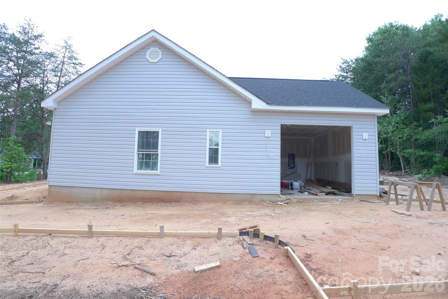Right side of house and garage Right side of house and garage