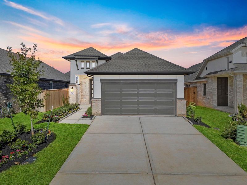 Front exterior of a new home in Grand Central Park, Conroe, TX, highlighting curb appeal (Image 21). Front exterior of a new home in Grand Central Park, Conroe, TX, highlighting curb appeal (Image 21).