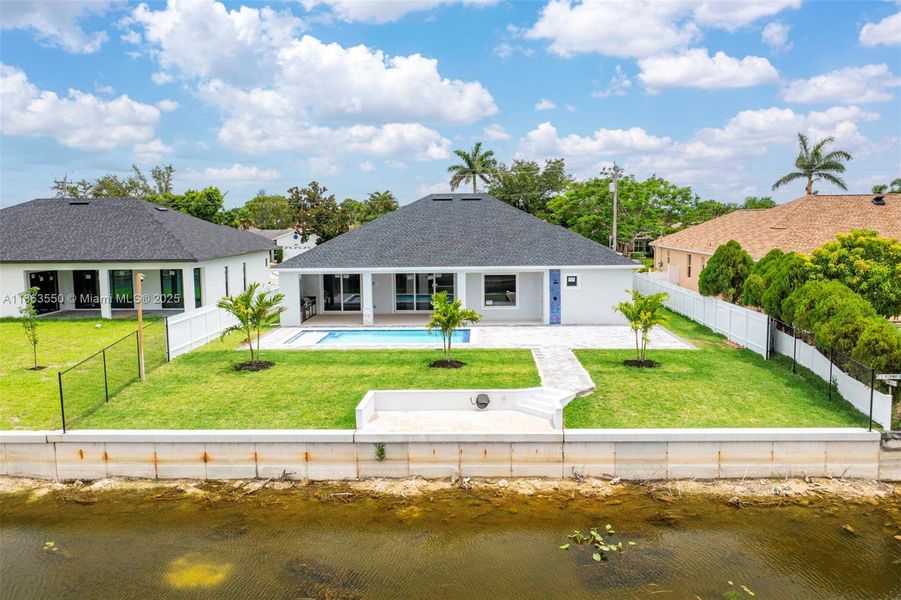 Front exterior of a new home in , Cape Coral, FL, highlighting curb appeal (Image 32). Front exterior of a new home in , Cape Coral, FL, highlighting curb appeal (Image 32).