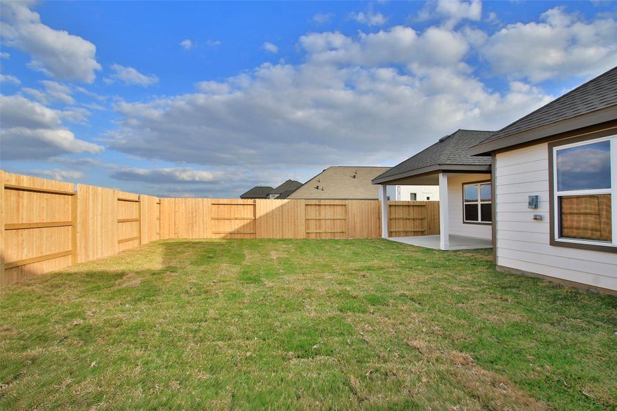 Exterior details and patio area of a home in Sunterra, Katy (Image 3).