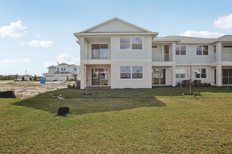 Exterior details and patio area of a home in Lagoon Residences at Epperson, Wesley Chapel (Image 27).
