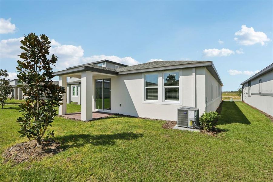 Exterior details and patio area of a home in Springs at Lake Alfred - Classic Series, Lake Alfred (Image 26).