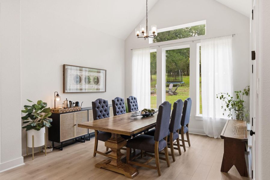 Wrapped in large windows that overlook the wooded backyard, the spacious dining area turns every daily meal or weekend dinner party into a scenic experience