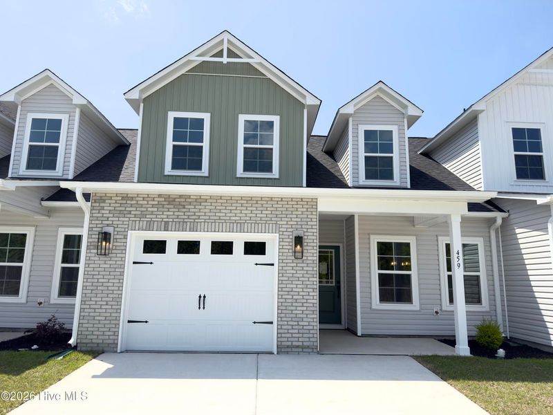 Front exterior of a new home in Autumn Trail, Bolivia, NC, highlighting curb appeal (Image 1). Front exterior of a new home in Autumn Trail, Bolivia, NC, highlighting curb appeal (Image 1).