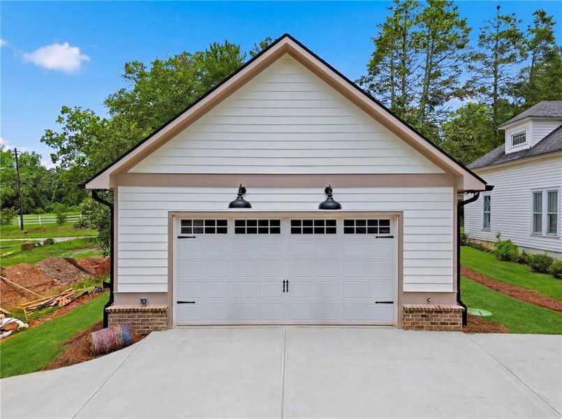 Front exterior of a new home in , Ball Ground, GA, highlighting curb appeal (Image 2). Front exterior of a new home in , Ball Ground, GA, highlighting curb appeal (Image 2).