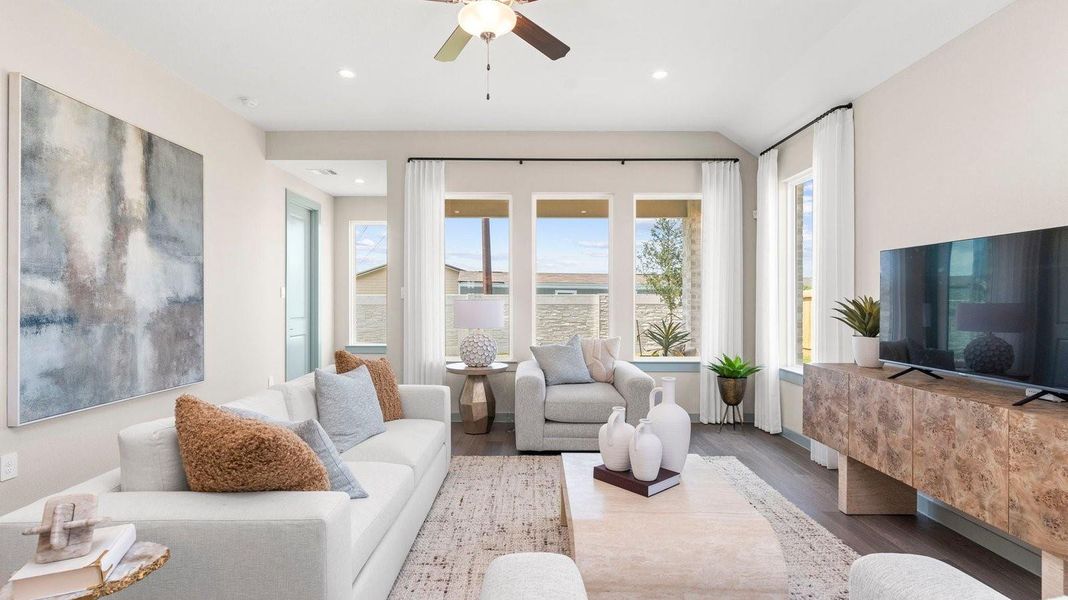 A cozy living room featuring a comfortable couch, a stylish coffee table, and an elegant painting on the wall. A cozy living room featuring a comfortable couch, a stylish coffee table, and an elegant painting on the wall.
