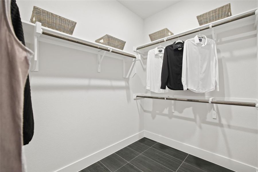 Spacious closet with dark tile patterned flooring