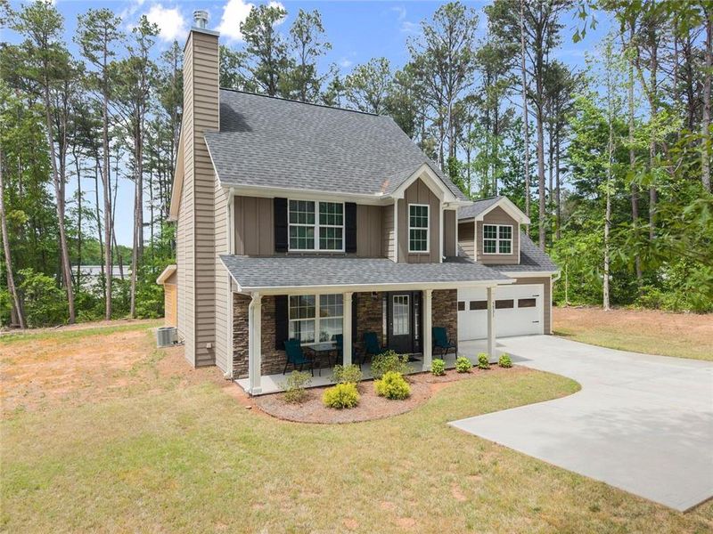 Front exterior of a new home in , Clermont, GA, highlighting curb appeal (Image 21).