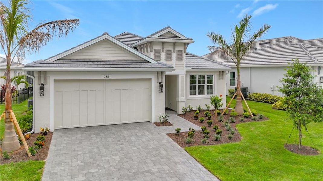 Front exterior of a new home in Watercolor Place, Bradenton, FL, highlighting curb appeal (Image 1). Front exterior of a new home in Watercolor Place, Bradenton, FL, highlighting curb appeal (Image 1).