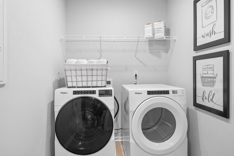 A washer and dryer in a room. A washer and dryer in a room.