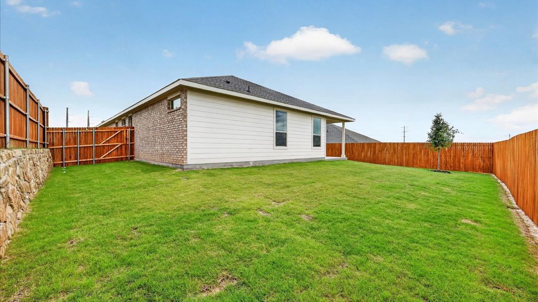 Exterior details and patio area of a home in Bluestem, Rhome (Image 2).