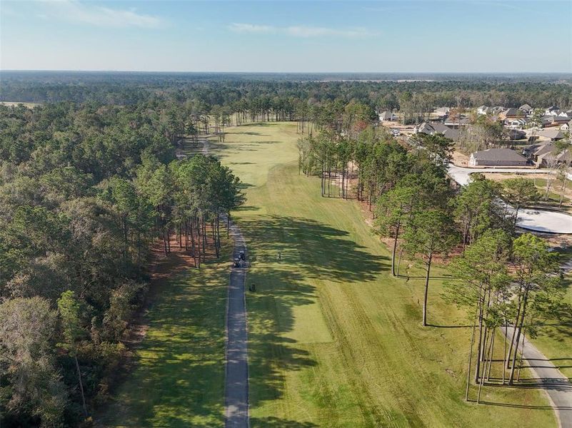 The Highlands community in Porter, TX, features the The Highlands Golf Club, which is a private country club offering a range of amenities including its 18-hole golf course, dining options, and social events.