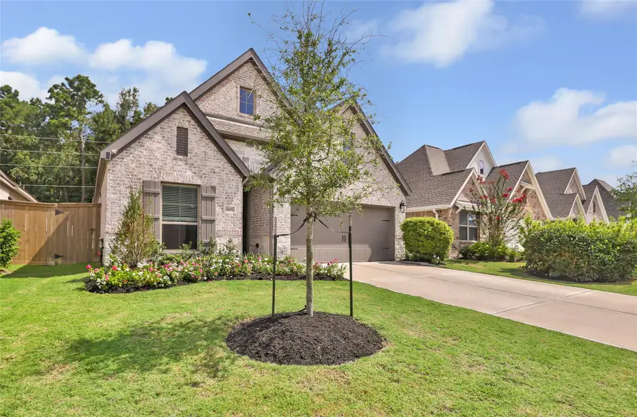 Front exterior of a new home in The Highlands, Porter, TX, highlighting curb appeal (Image 24).