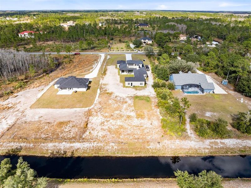 Aerial view of the canal that sits behind the home.