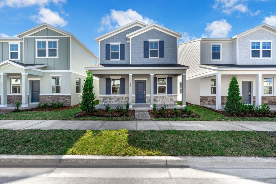 Front exterior of a new home in Brack Ranch, St. Cloud, FL, highlighting curb appeal (Image 28). Front exterior of a new home in Brack Ranch, St. Cloud, FL, highlighting curb appeal (Image 28).