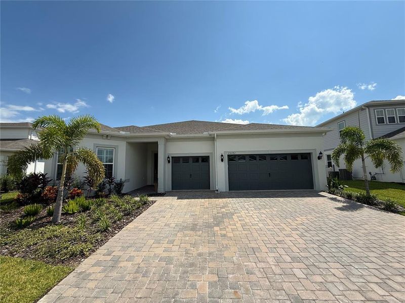 Front exterior of a new home in , Montverde, FL, highlighting curb appeal (Image 21). Front exterior of a new home in , Montverde, FL, highlighting curb appeal (Image 21).