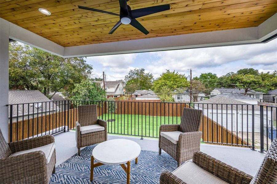 View of patio with ceiling fan and a residential view View of patio with ceiling fan and a residential view