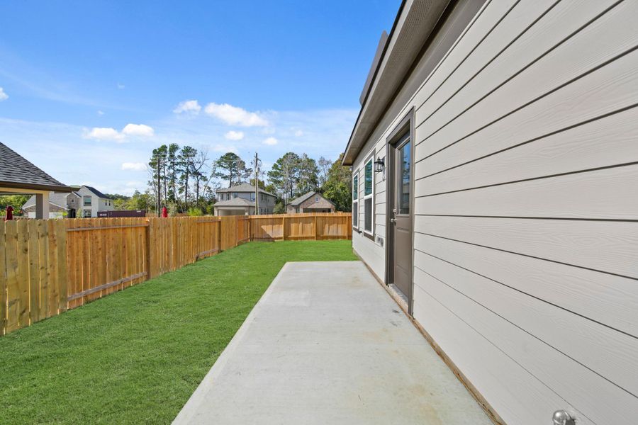 Exterior details and patio area of a home in Lexington Heights, Willis (Image 4). Exterior details and patio area of a home in Lexington Heights, Willis (Image 4).