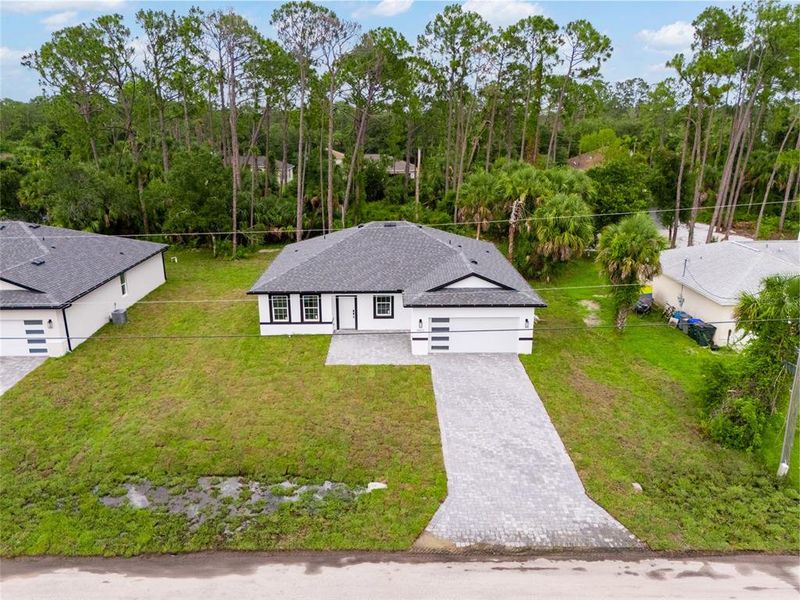 Front exterior of a new home in , North Port, FL, highlighting curb appeal (Image 20).
