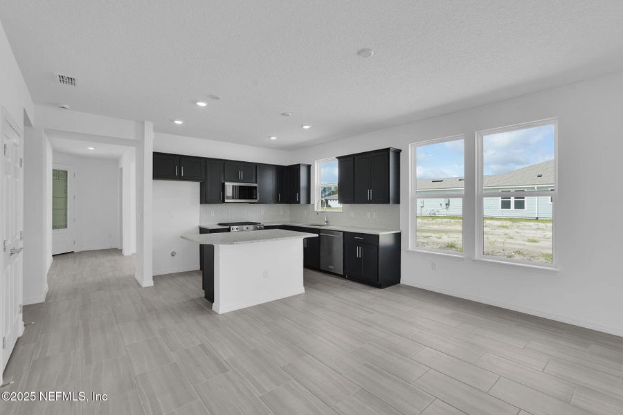 Furnished interior view inside a new home in Del Webb Wildlight, Yulee (Image 10).