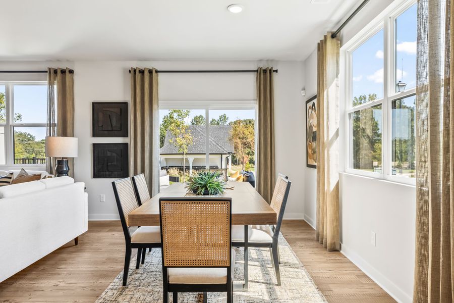 A dining room with a large window. A dining room with a large window.