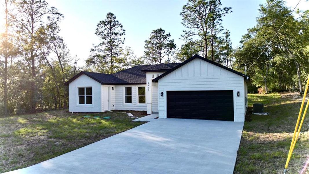Front exterior of a new home in , Dunnellon, FL, highlighting curb appeal (Image 2). Front exterior of a new home in , Dunnellon, FL, highlighting curb appeal (Image 2).