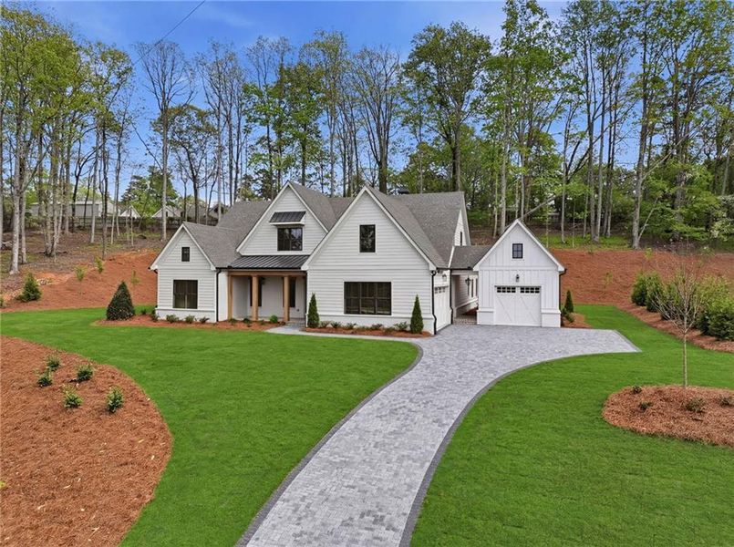 Front exterior of a new home in , Cumming, GA, highlighting curb appeal (Image 2). Front exterior of a new home in , Cumming, GA, highlighting curb appeal (Image 2).