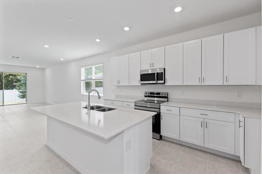 Furnished interior view inside a new home in Mirror Lake Village, Fruitland Park (Image 1).