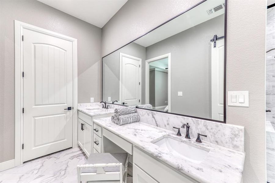 Double sinks for convenience & a walk-in shower!