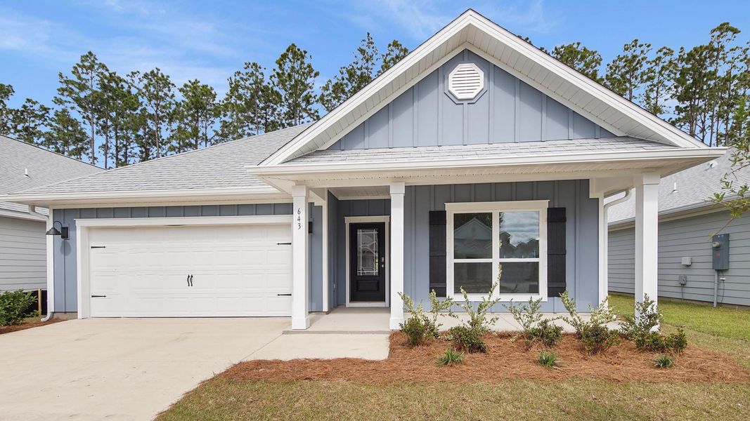 Front exterior of a new home in Bayside at Ward Creek, Panama City Beach, FL, highlighting curb appeal (Image 2). Front exterior of a new home in Bayside at Ward Creek, Panama City Beach, FL, highlighting curb appeal (Image 2).