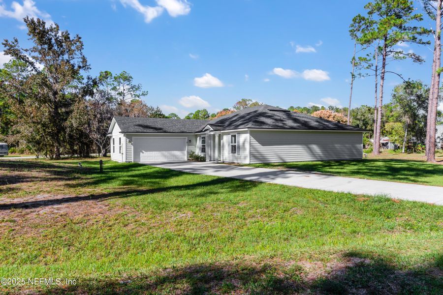 Front exterior of a new home in , Satsuma, FL, highlighting curb appeal (Image 1). Front exterior of a new home in , Satsuma, FL, highlighting curb appeal (Image 1).