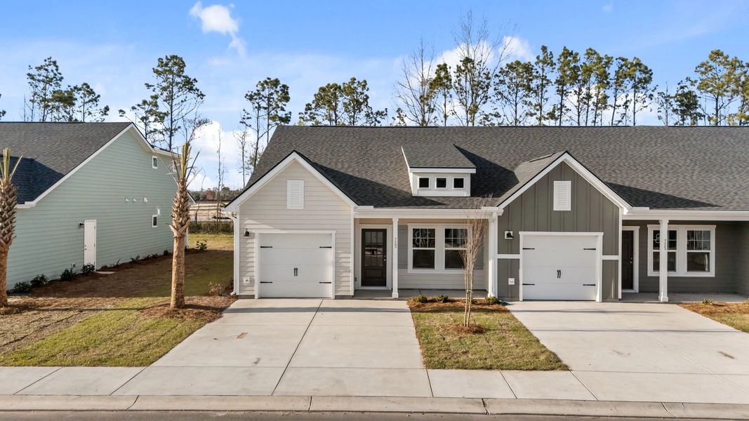 Front exterior of a new home in Blue Heron Retreat, Little River, SC, highlighting curb appeal (Image 2). Front exterior of a new home in Blue Heron Retreat, Little River, SC, highlighting curb appeal (Image 2).