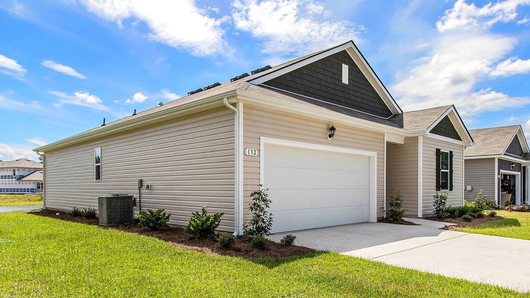 Front exterior of a new home in The Bluffs at Mill Creek, Florence, SC, highlighting curb appeal (Image 18).