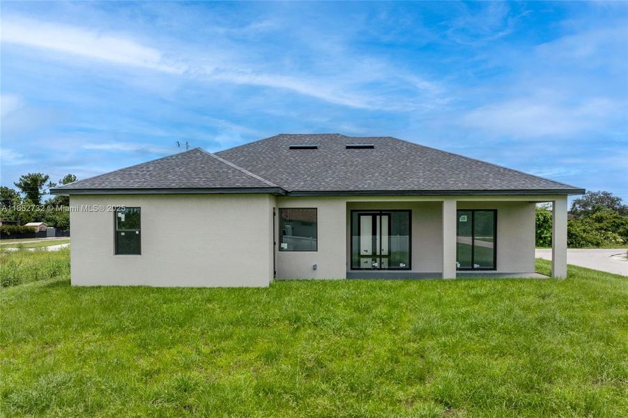 Front exterior of a new home in , Lehigh Acres, FL, highlighting curb appeal (Image 17). Front exterior of a new home in , Lehigh Acres, FL, highlighting curb appeal (Image 17).