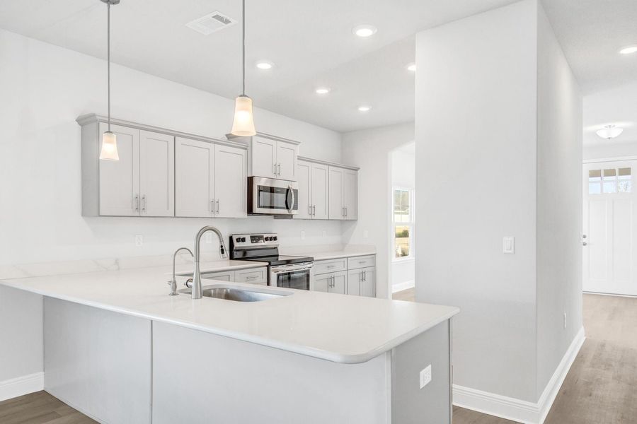 Furnished interior view inside a new home in The Bluffs at Lafayette, Freeport (Image 6).