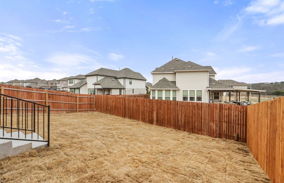 Exterior details and patio area of a home in Saddleback at Santa Rita Ranch, Liberty Hill (Image 26).