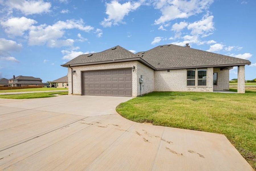 Representative exterior photo of a completed home built from the The Elm by Sumeer Homes in Stone Henge II, Sanger, TX (Image 18). Representative exterior photo of a completed home built from the The Elm by Sumeer Homes in Stone Henge II, Sanger, TX (Image 18).