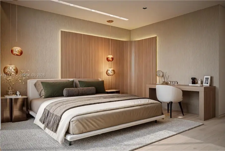 Curved wood-paneled accent wall with integrated ambient lighting, linear recessed ceiling lighting, three suspended glass pendant lights, and built-in wood-finish desk